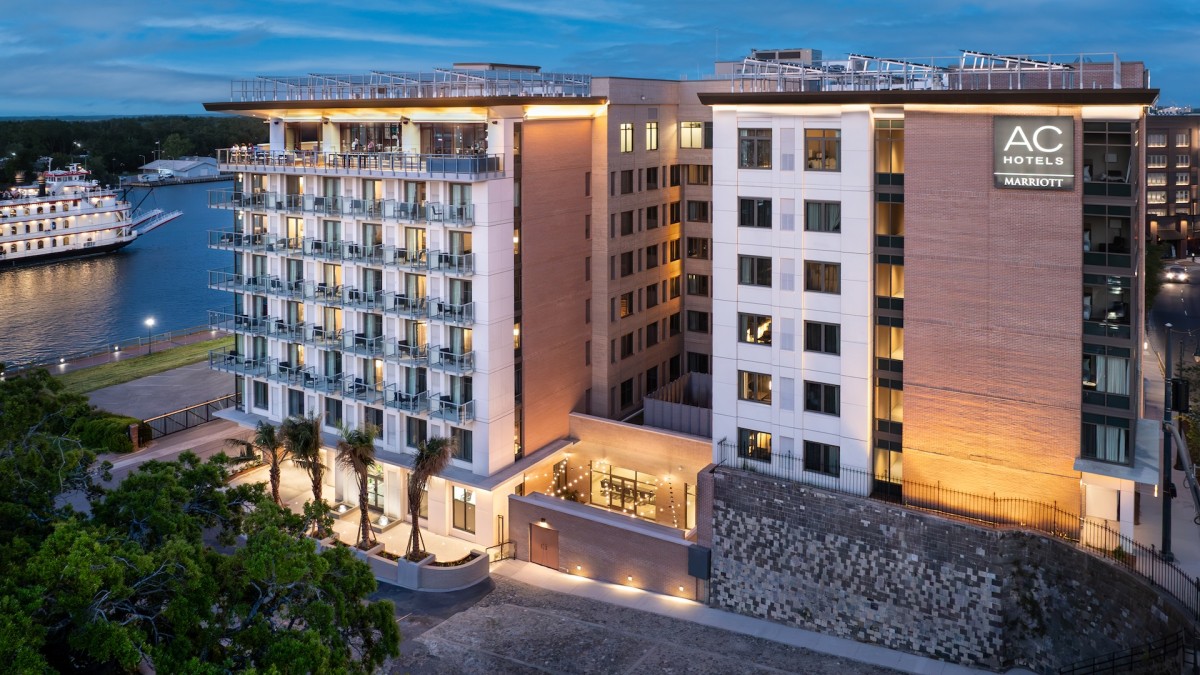 An evening drone image of a hotel.