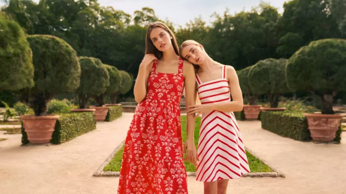 Two retail models posing together.