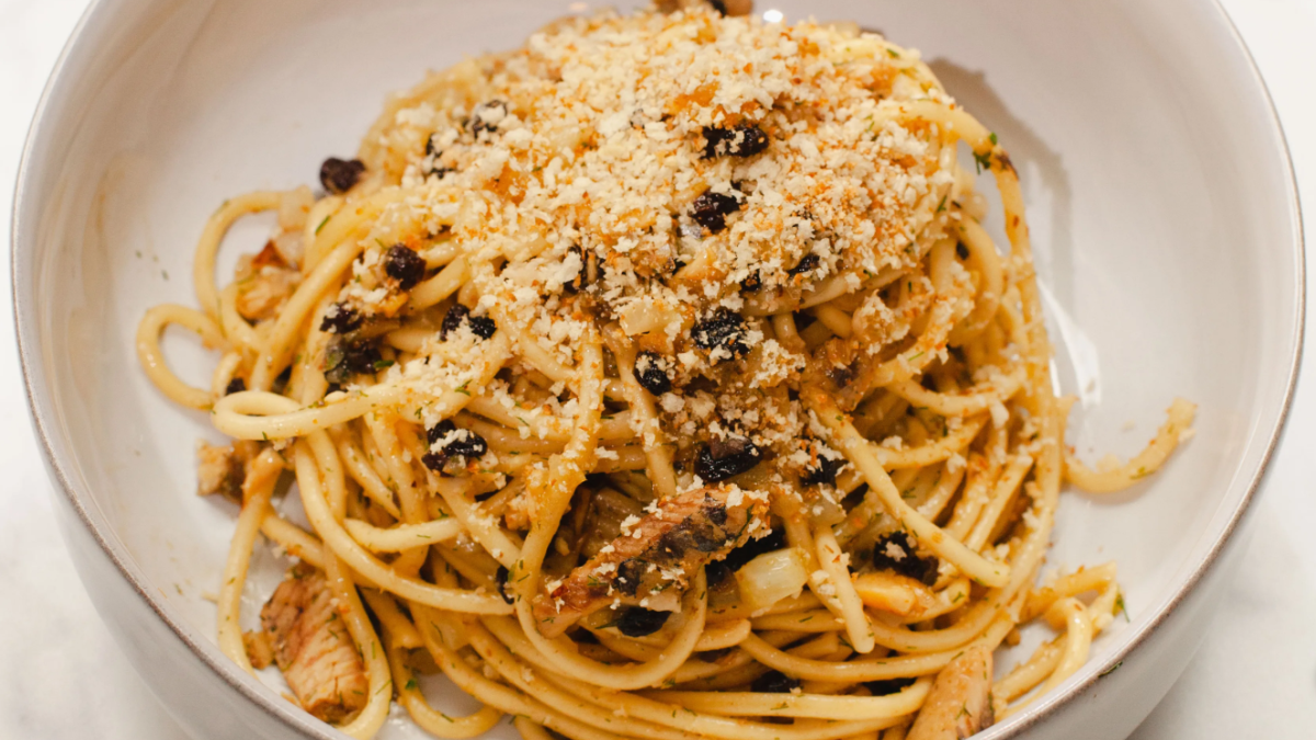 A large serving of pasta in a white plate.
