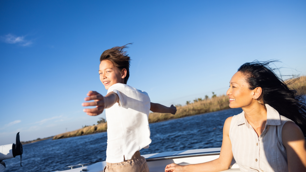 A mother and child enjoying a boat ride.