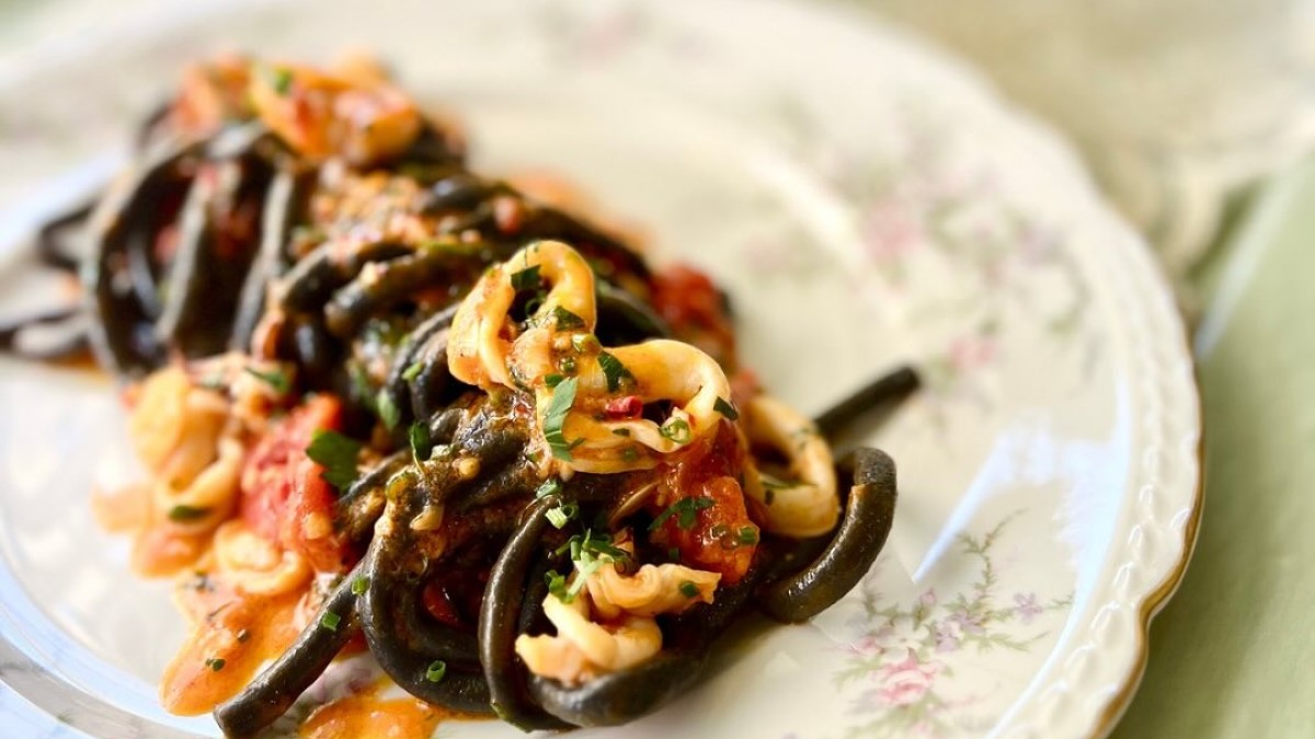 A plate of pasta served on fine China.
