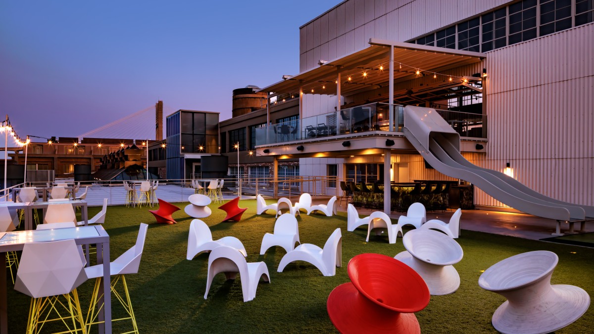 A rooftop bar with eclectic and modernized seating overlooking the Savannah River.