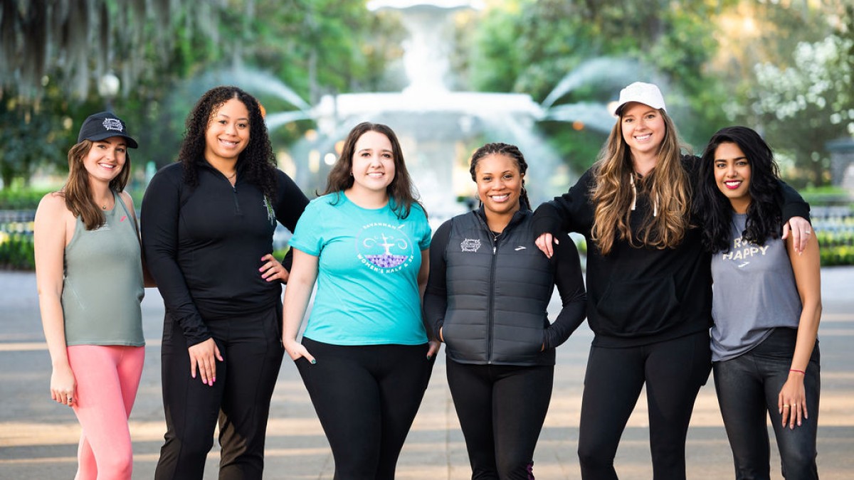 sports council team members in front of Forsyth Park fountain