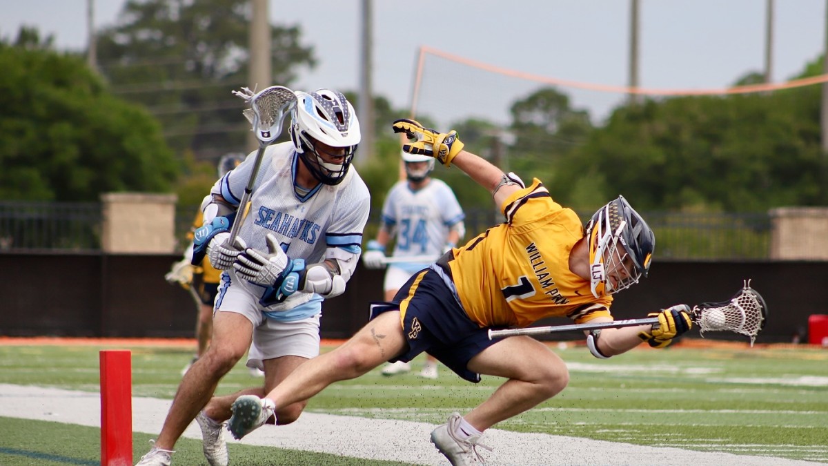 two lacrosse players running