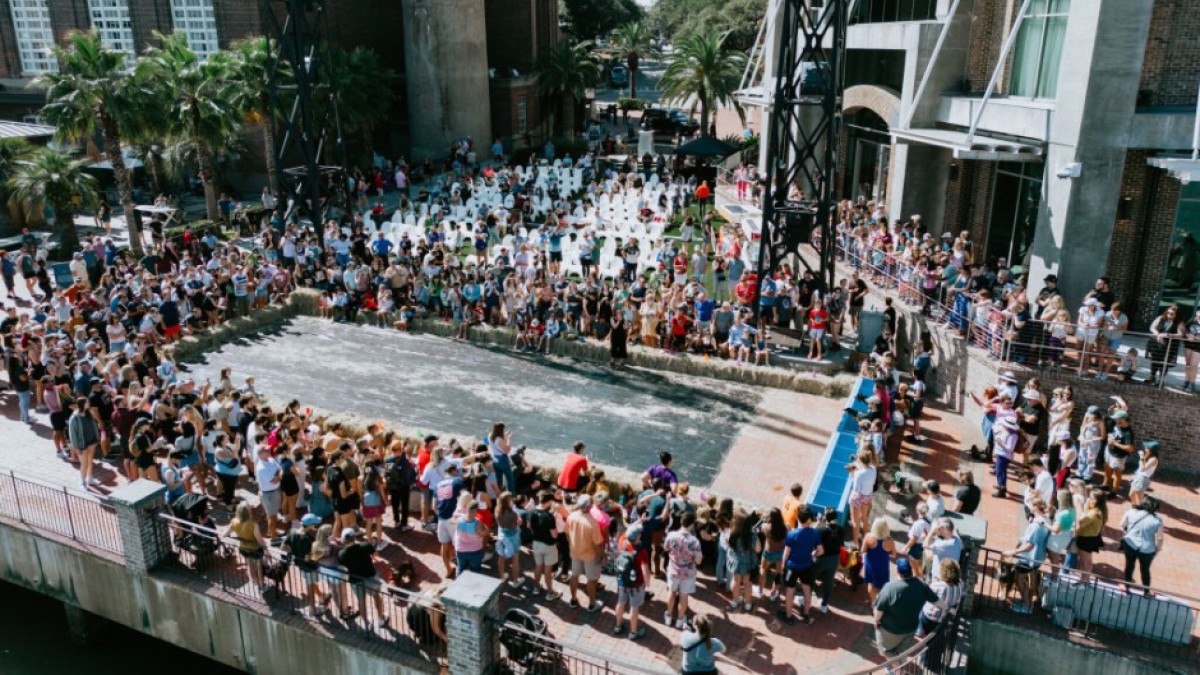 A large crowd of people gathered on River Street in Savannah, Ga for an Oktoberfest event.