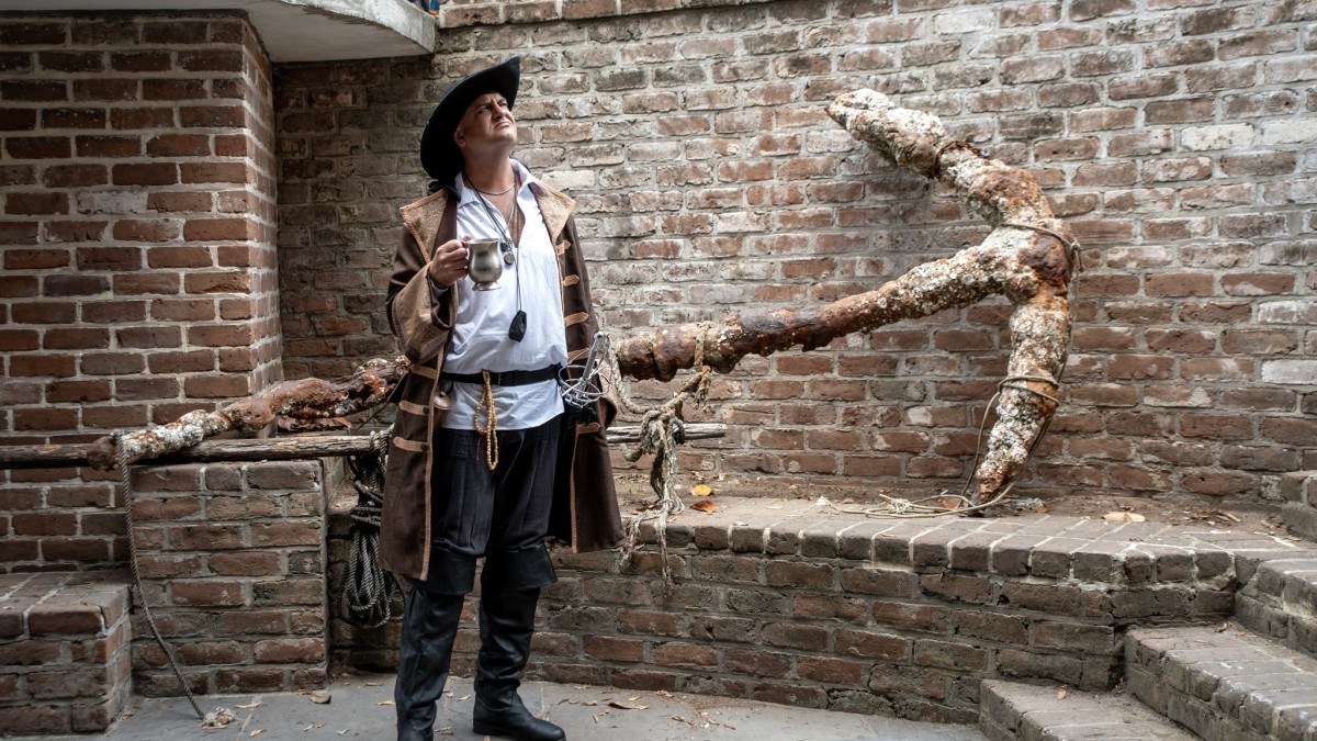 A man dressed in pirate attire.