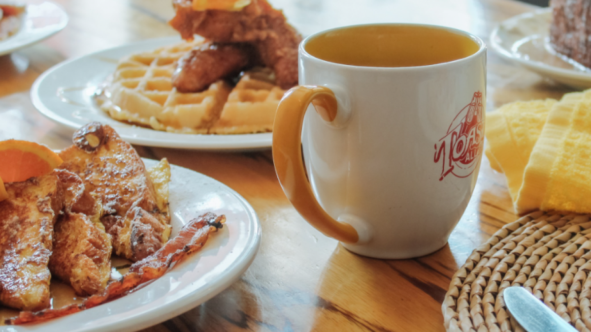 A variety of breakfast and brunch items served on a table at Toast! All Day restaurant.