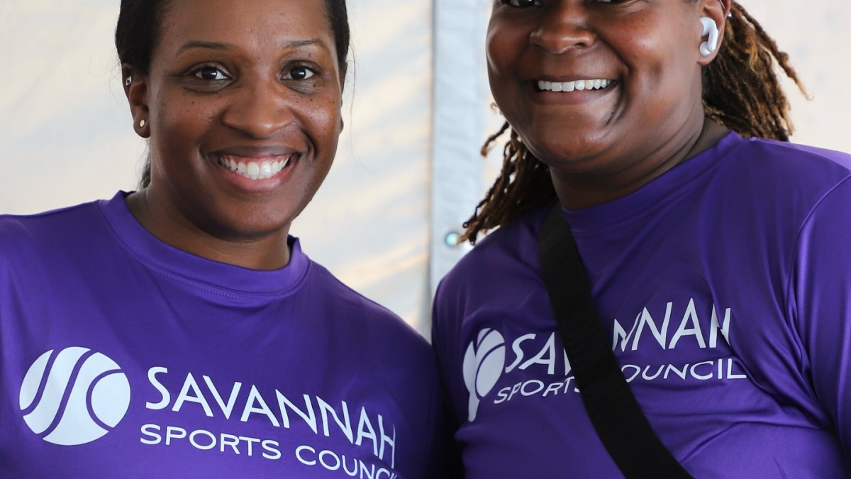 two women smiling in savannah sports council shirts