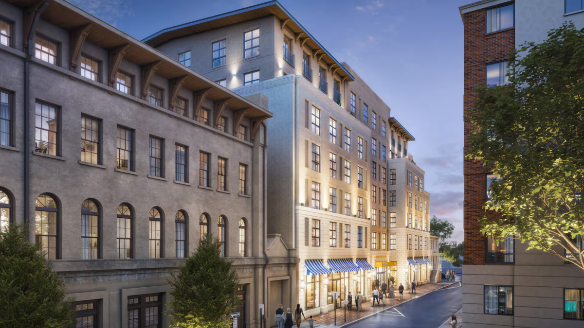 Exterior rendering of Tempo by Hilton Savannah Historic District, showing a modern mid-rise hotel with illuminated windows, street-level storefronts, and pedestrians walking along a city street at dusk.