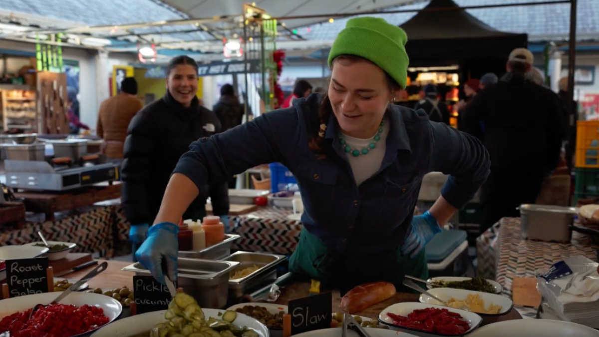 A vendor serving food at the Milk Market in Limerick Ireland.