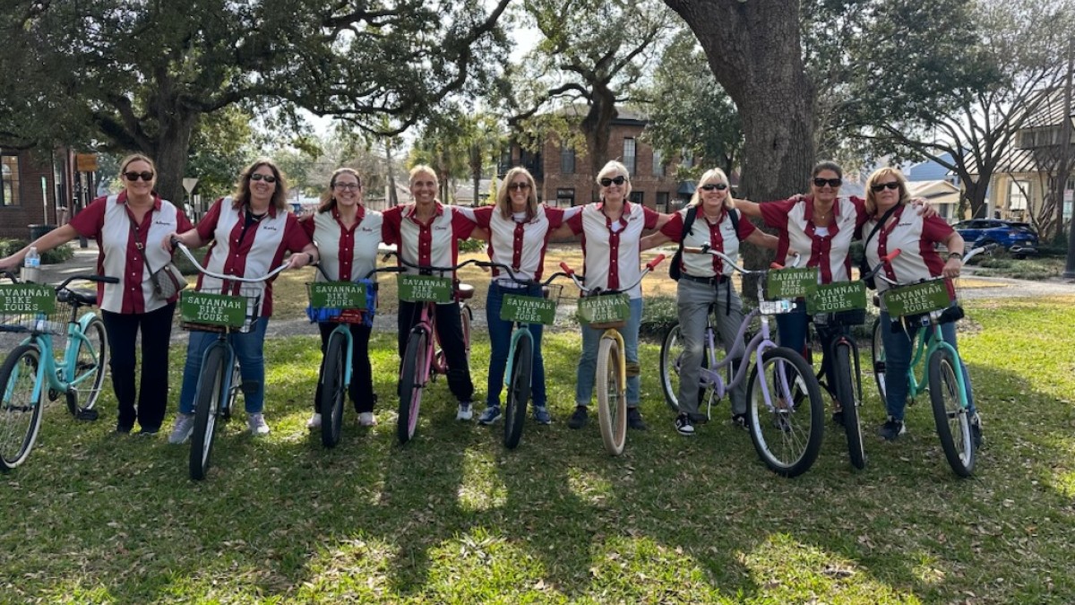 A private group posing for a photo during a bike tour with Savannah Bike Tours