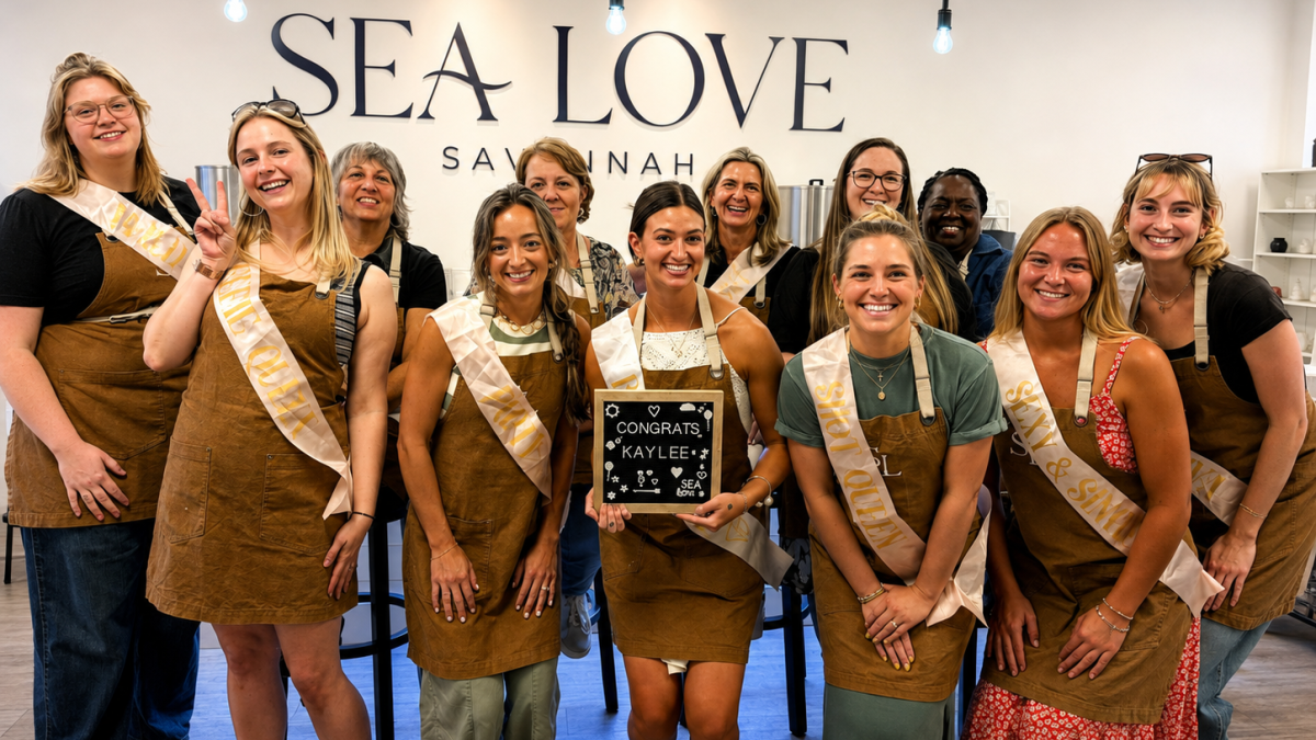 A bachelorette group pose for a photo at Sea Love Candle Bar.
