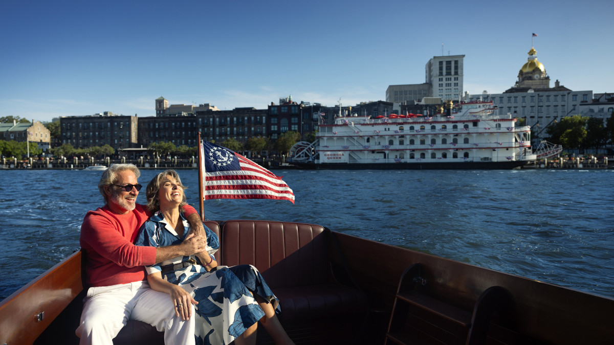Couple enjoying a boat ride along the Savannah River.