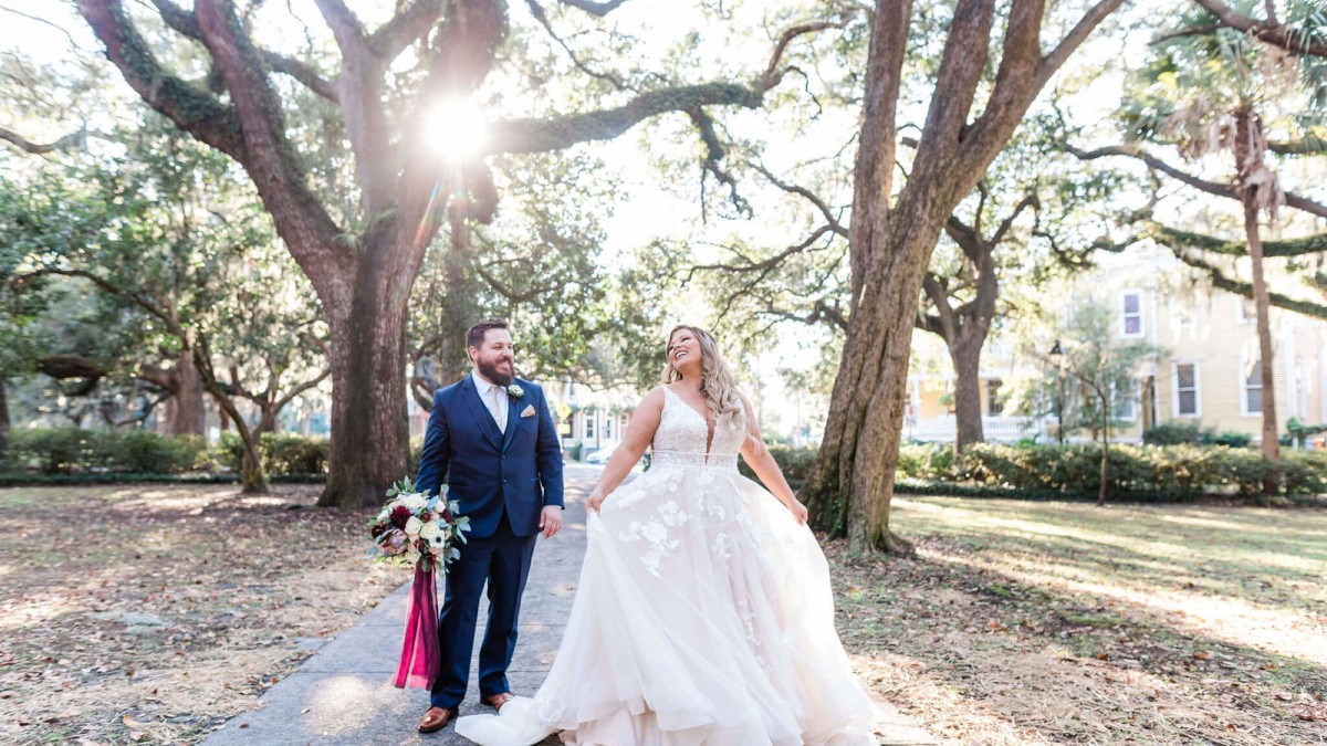 A bride and groom in Lafayette Square in Savannah, Georgia A bride and groom in Lafayette Square in Savannah, Georgia
