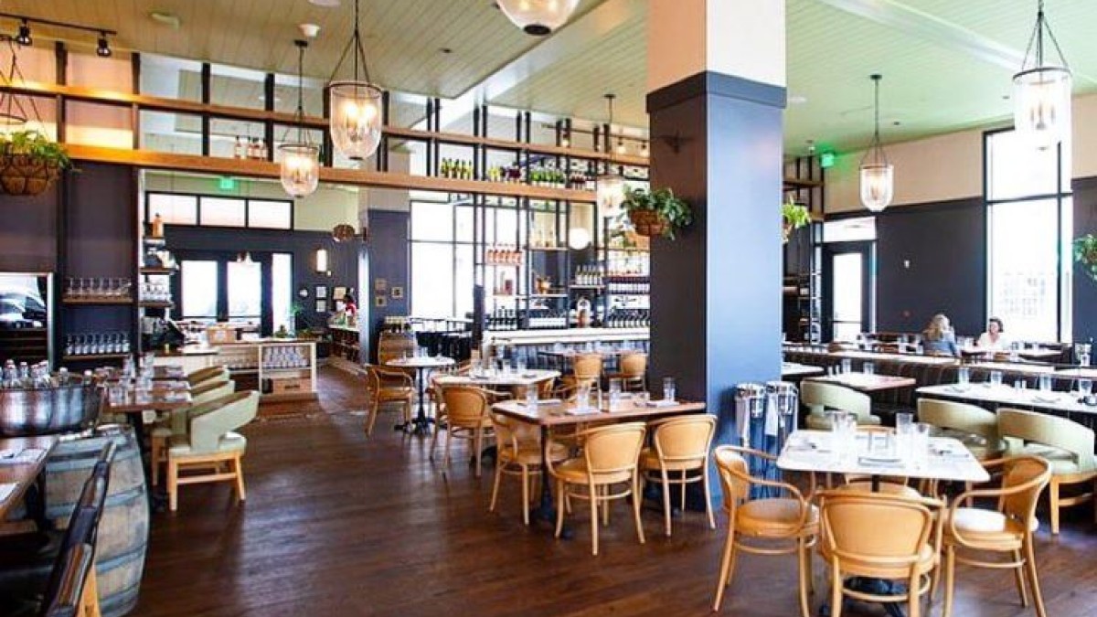 The Emporium Kitchen & Wine Market is located in the Perry Lane Hotel. The Emporium Kitchen & Wine Market is located in the Perry Lane Hotel.