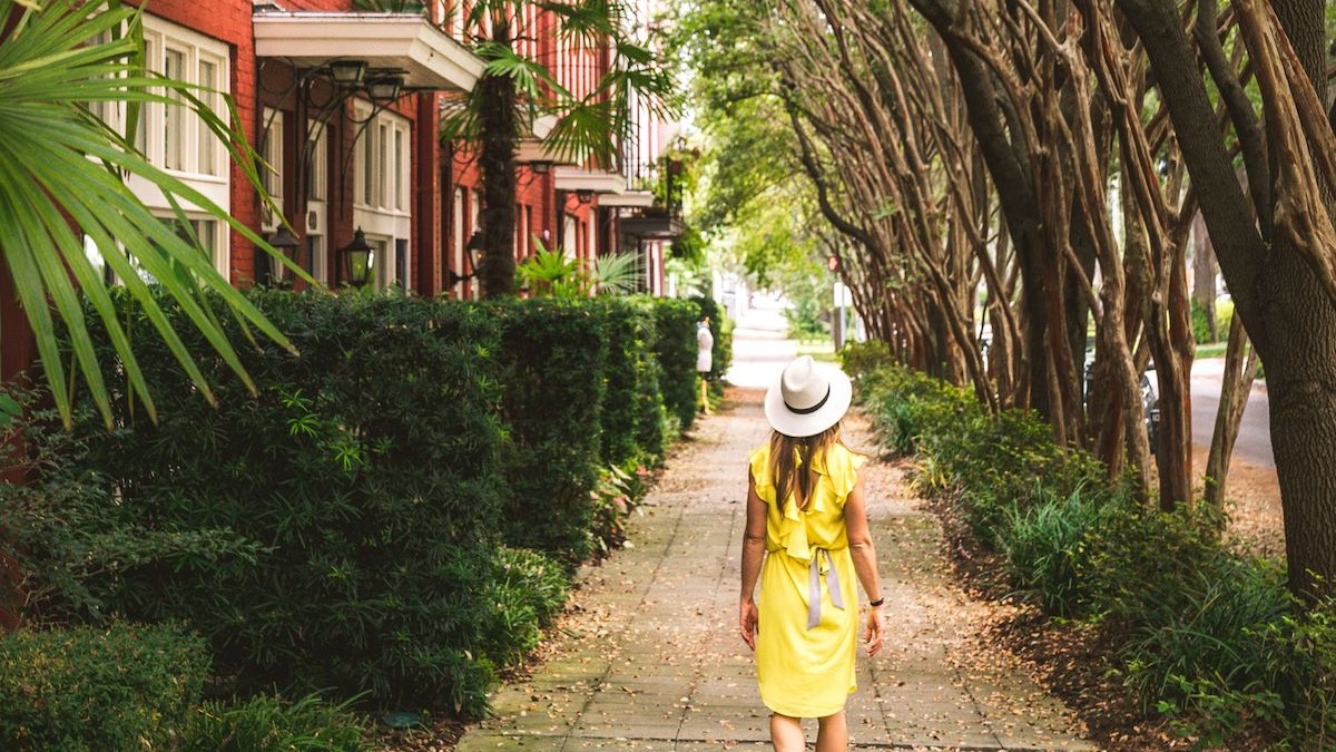 Solo traveler in Savannah. Solo traveler walking the street in Savannah, Georgia.