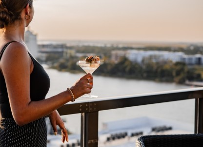 Bar Julian, woman looking over the river