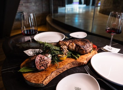Steak served on a wooden board.