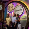 A family of three enjoying an immersive 4D story experience about the history of Savannah College of Art and Design.