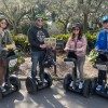 A group posing for a photo on segways with Adventure Tours in Motion