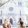 Visitors snap photos of the Cathedral of St. John the Baptist