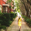 Solo traveler walking the street in Savannah, Georgia.