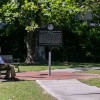 A man looks at The Weeping Time Historic Marker in Savannah, Georgia