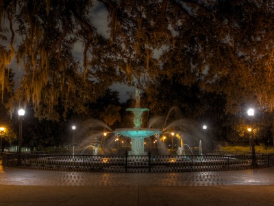 An eerie view of Forsyth Park at night