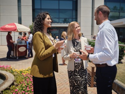 attendees outside convention center talking and eating ice cream