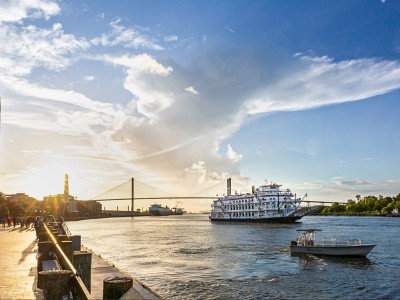River Street at sunset with a riverboat on the water