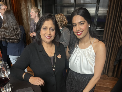 Two ladies posing for a picture.