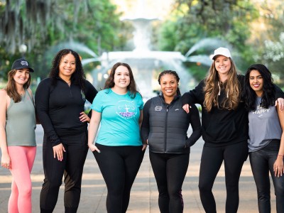 sports council team members in front of Forsyth Park fountain