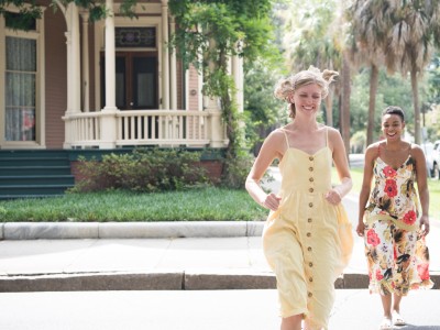 Two friends running through Savannah’s Victorian District neighborhood.