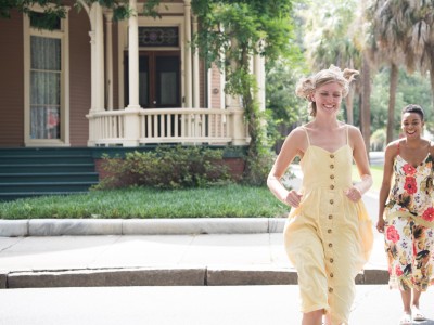 Two friends running through Savannah’s Victorian District neighborhood.