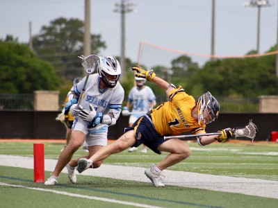 two lacrosse players running