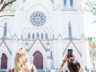 The Cathedral of St. John the Baptist is an iconic architectural masterpiece. Visitors snap photos of the Cathedral of St. John the Baptist