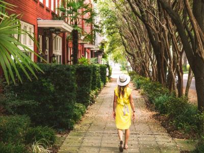 Solo traveler in Savannah. Solo traveler walking the street in Savannah, Georgia.