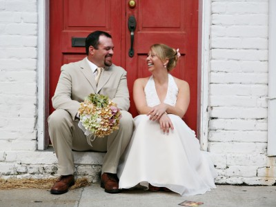 A couple sits in a doorway in Savannah, Georgia. A couple sits in a doorway in Savannah, Georgia.